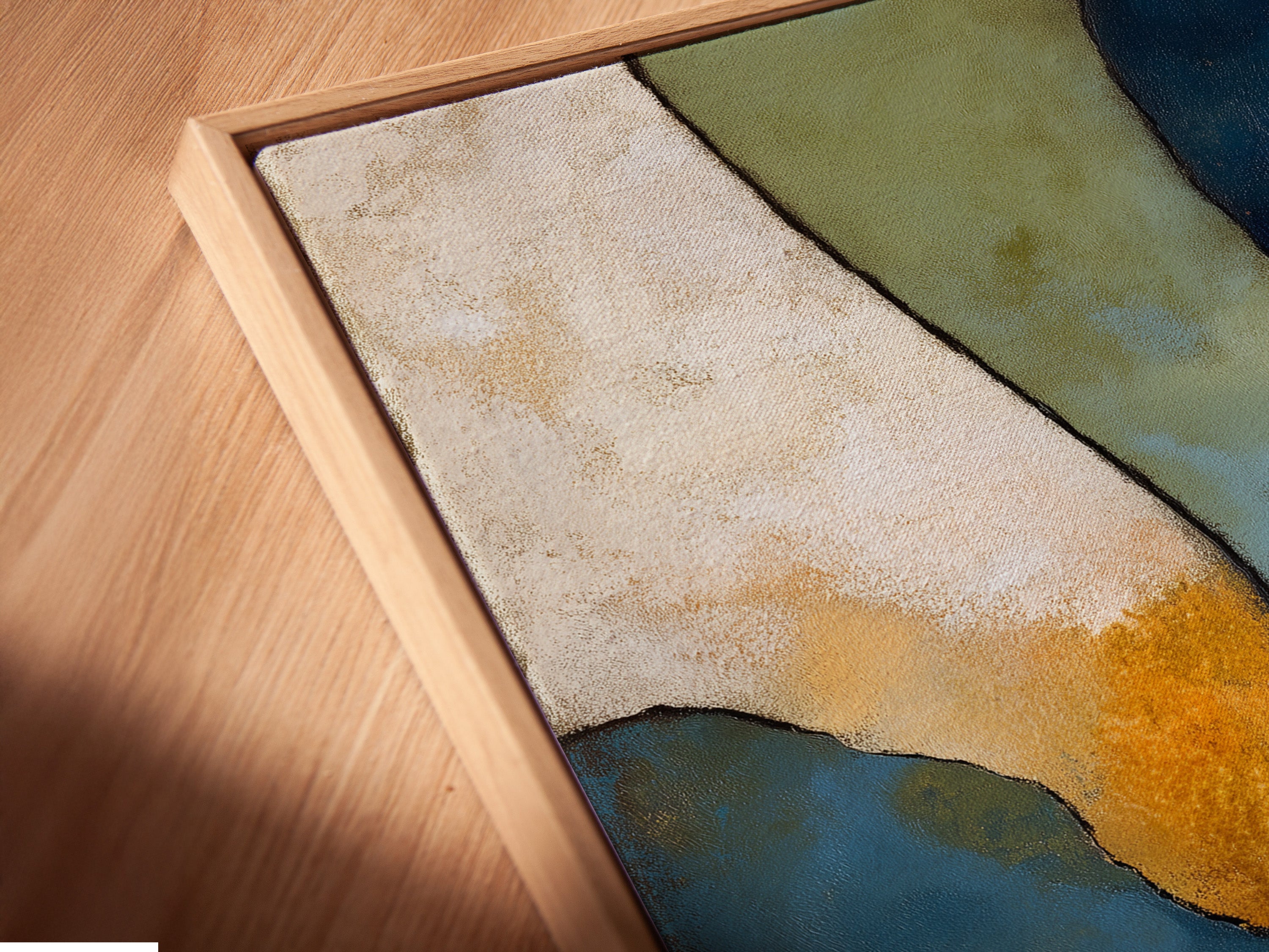 A close-up angled view of a canvas print in a floating frame. The abstract geometric artwork showcases earth tone prints. It is a perfect contemporary art piece for modern homes. The floating frame enhances the artwork's elegance and style.