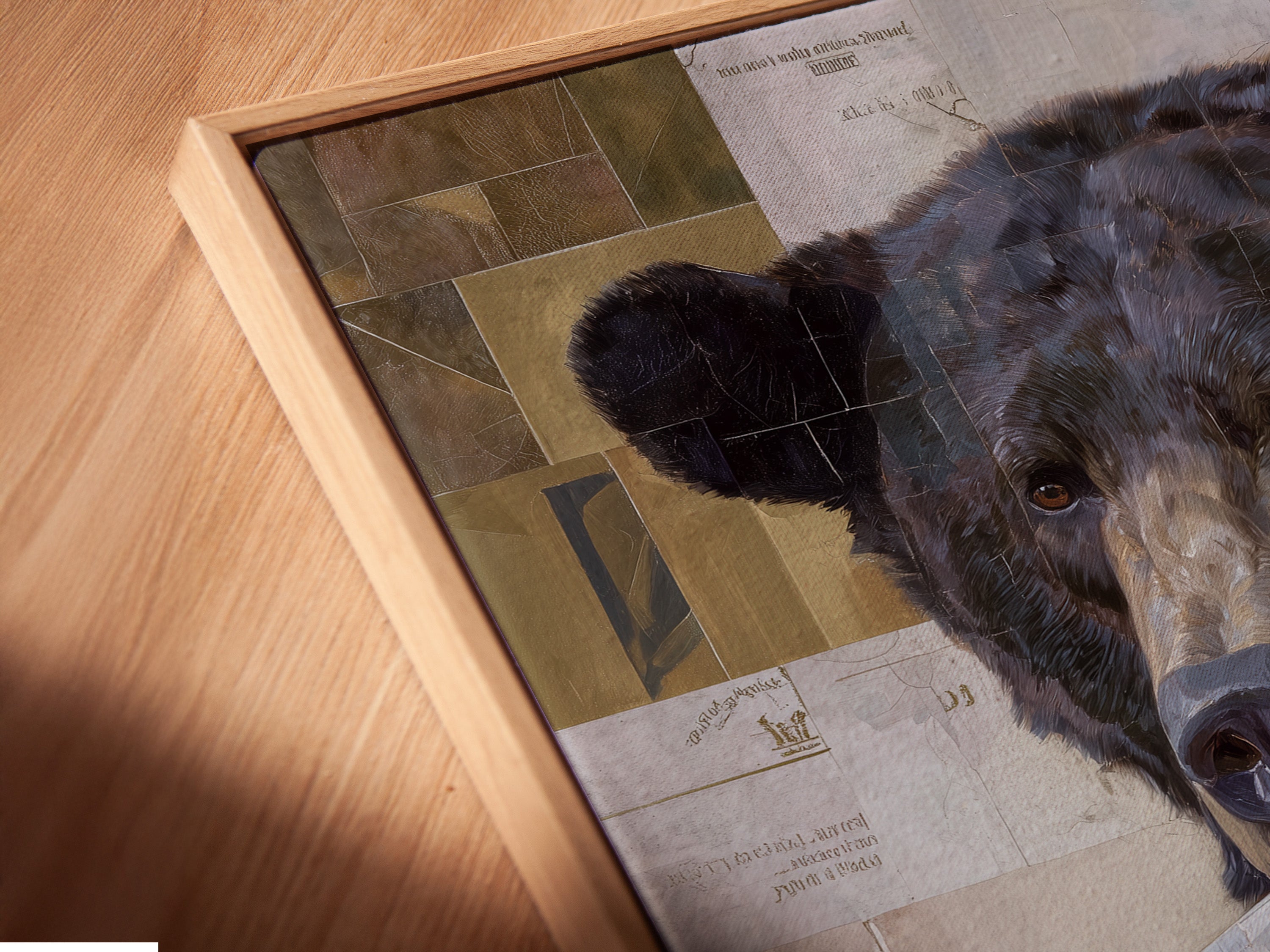 Angled close up of a canvas print. The print features a vintage collage bear portrait in a floating frame. This eclectic animal artwork is perfect for adding character to any room. This piece suits vintage rustic and bohemian styles.