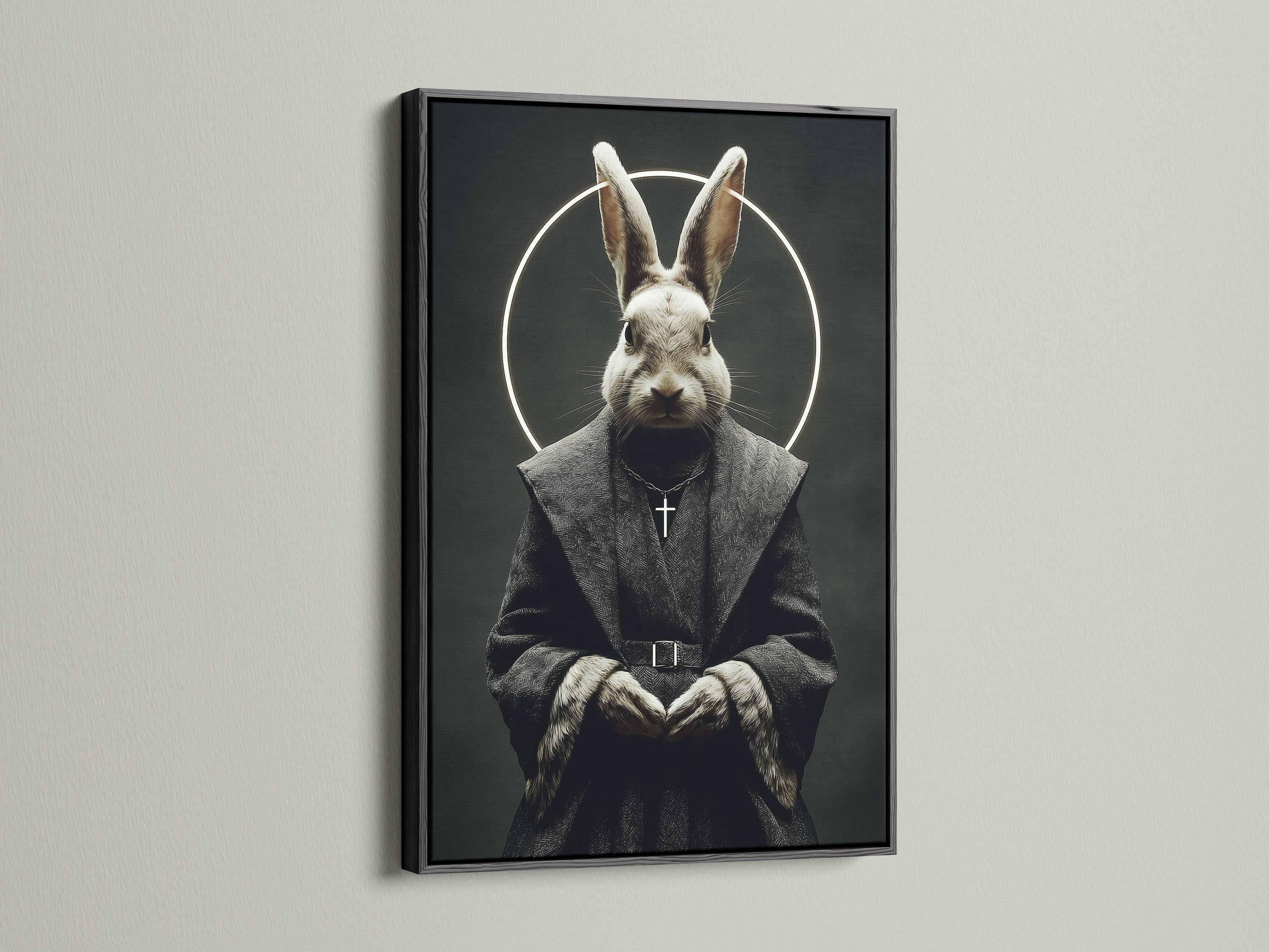 The rabbit monk art print is displayed in a sleek black frame. The dark frame enhances the gothic elements of the artwork. It is a striking piece of religious art for a modern space. This animal portrait is perfect for gothic home decor.