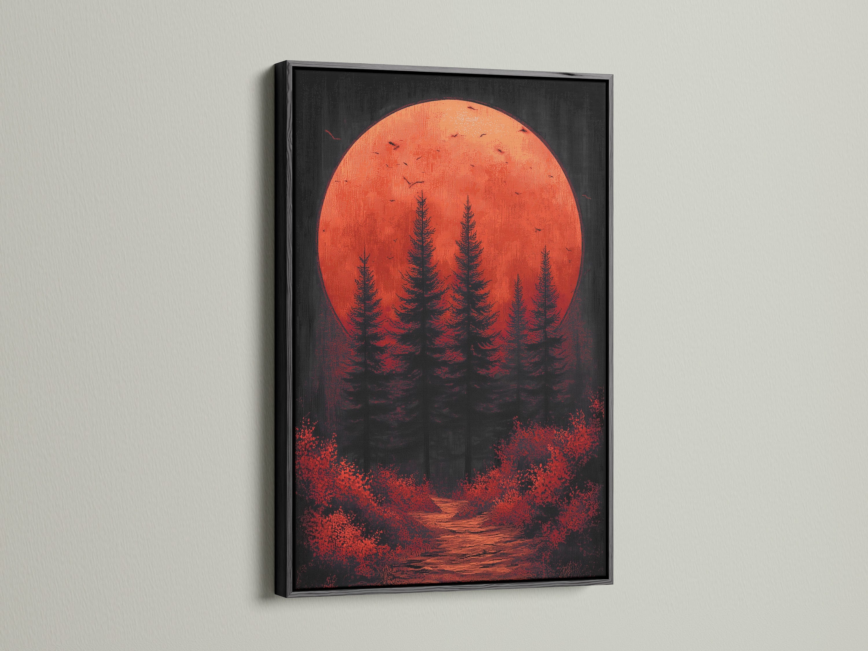 The forest moon artwork is presented in a sleek black frame. This dark nature art piece features a red sunset print. It adds a touch of sophistication to any space. Perfect as living room wall art or office wall art this print offers a contemporary style.