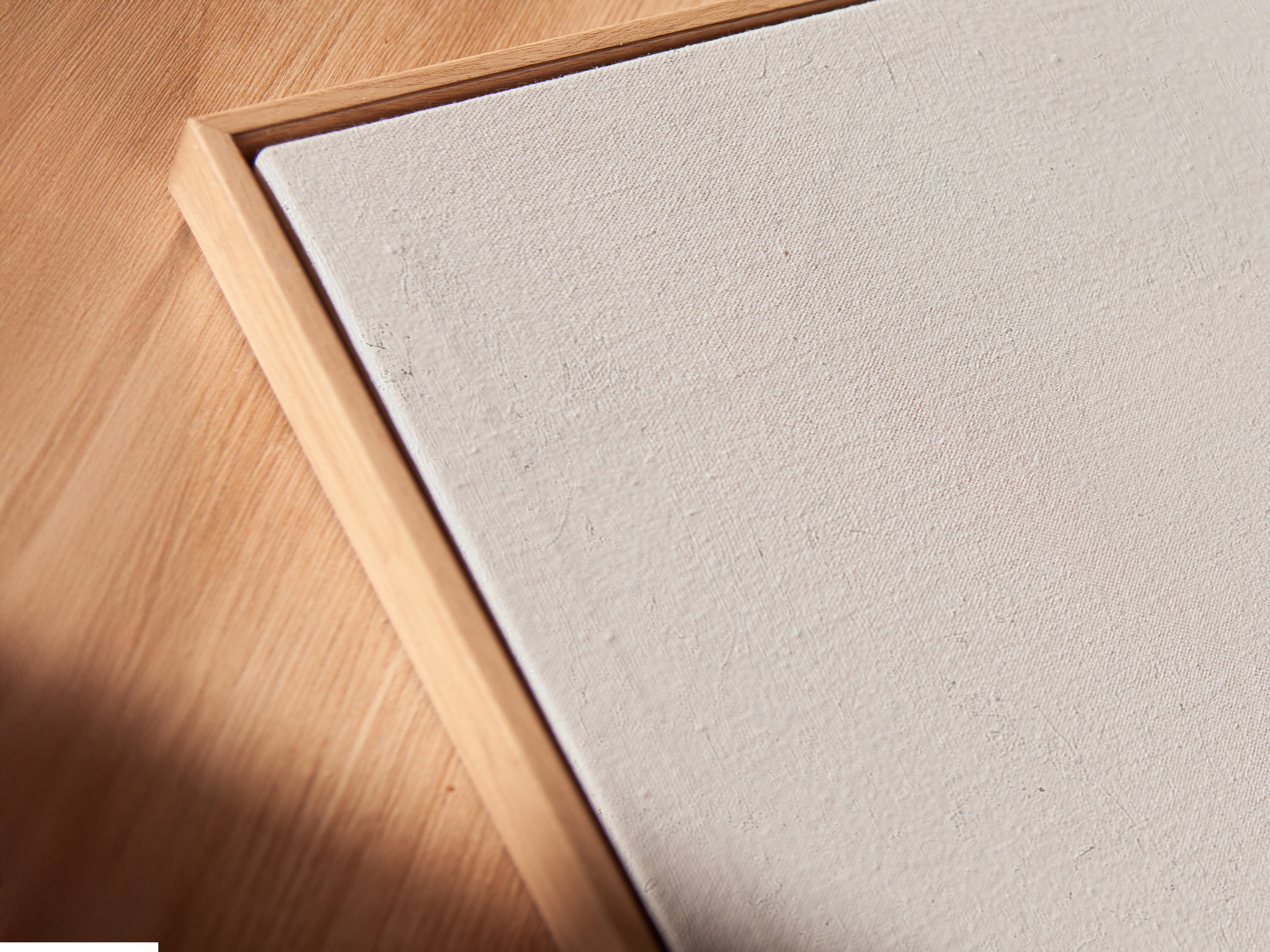 Get a closer look at our canvas print in a floating frame. This angled view showcases the artwork's detail. The minimalist piece features an elderly couple. This elegant framing style adds depth and sophistication. Transform your walls with this stunning art print today.