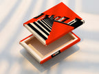 Stretched canvas print of the Architectural Stairs artwork. The bold orange modern wall art creates a vibrant statement. This geometric building canvas is perfect for any modern space. Transform your living room wall art with this contemporary piece. Elevate your home decor with this stunning print.
