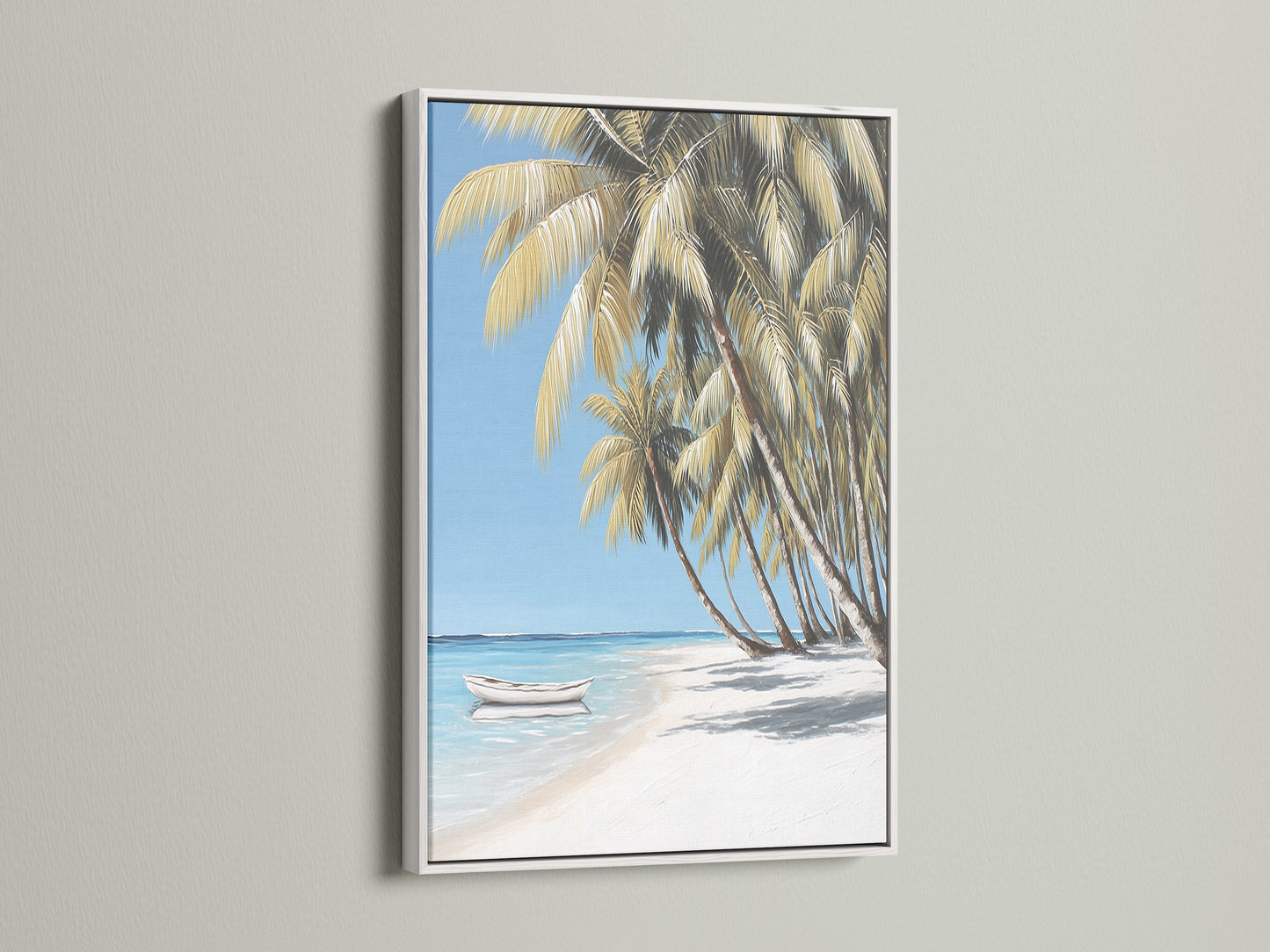 Coastal artwork featuring a tropical beach scene with a white frame. The art shows palm trees a white sand beach and clear blue water. Add a serene ocean view to your living room or beach house with this beautiful art.