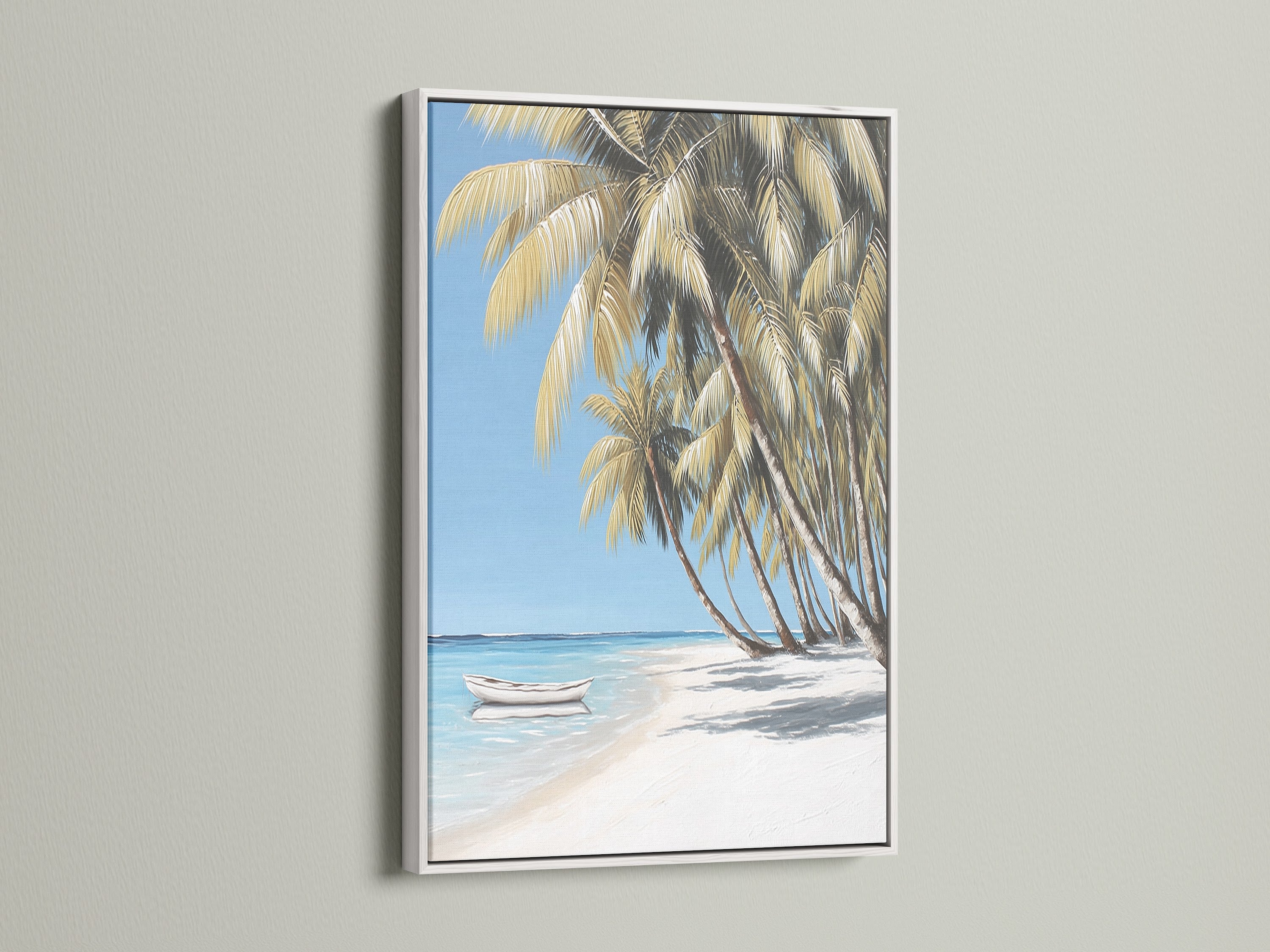 Coastal artwork featuring a tropical beach scene with a white frame. The art shows palm trees a white sand beach and clear blue water. Add a serene ocean view to your living room or beach house with this beautiful art.
