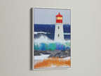 Lighthouse print displayed in a white frame. This nautical wall decor adds a fresh touch to any room. The white frame complements the coastal theme. Ocean artwork brings a sense of calm and serenity.