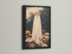 A striking black frame highlights a captivating ghost artwork. The ghost artwork is adorned with flowers for a unique look. The black frame adds a touch of sophistication and drama. Perfect for creating a focal point in your room with spooky art. The artwork is sure to catch the eye.