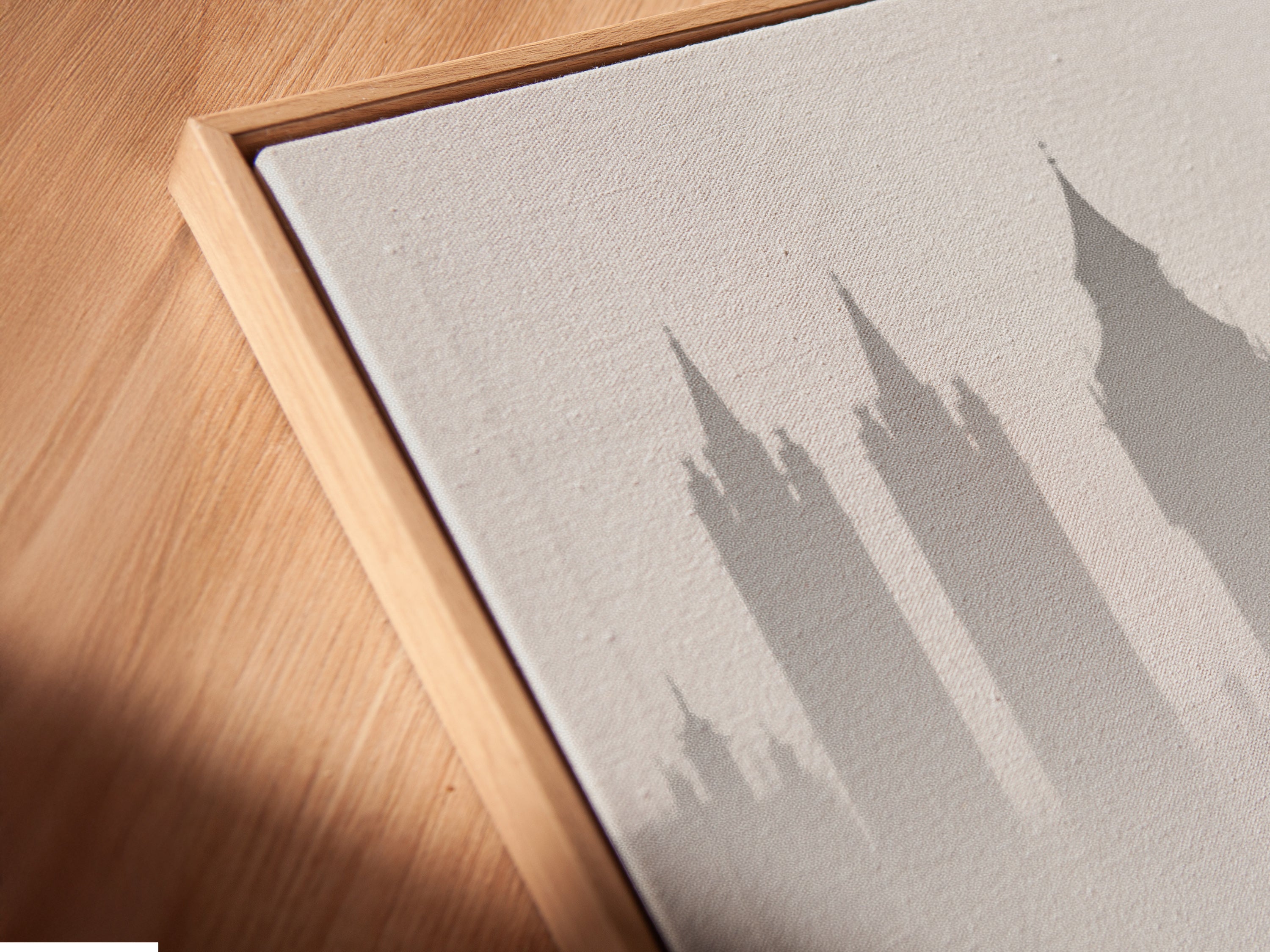 Get a closer look at our canvas print in a floating frame. The black and white London artwork stands out. The floating frame adds depth to this cityscape print. Perfect for modern interiors seeking minimalist decor. See the quality of our urban photography