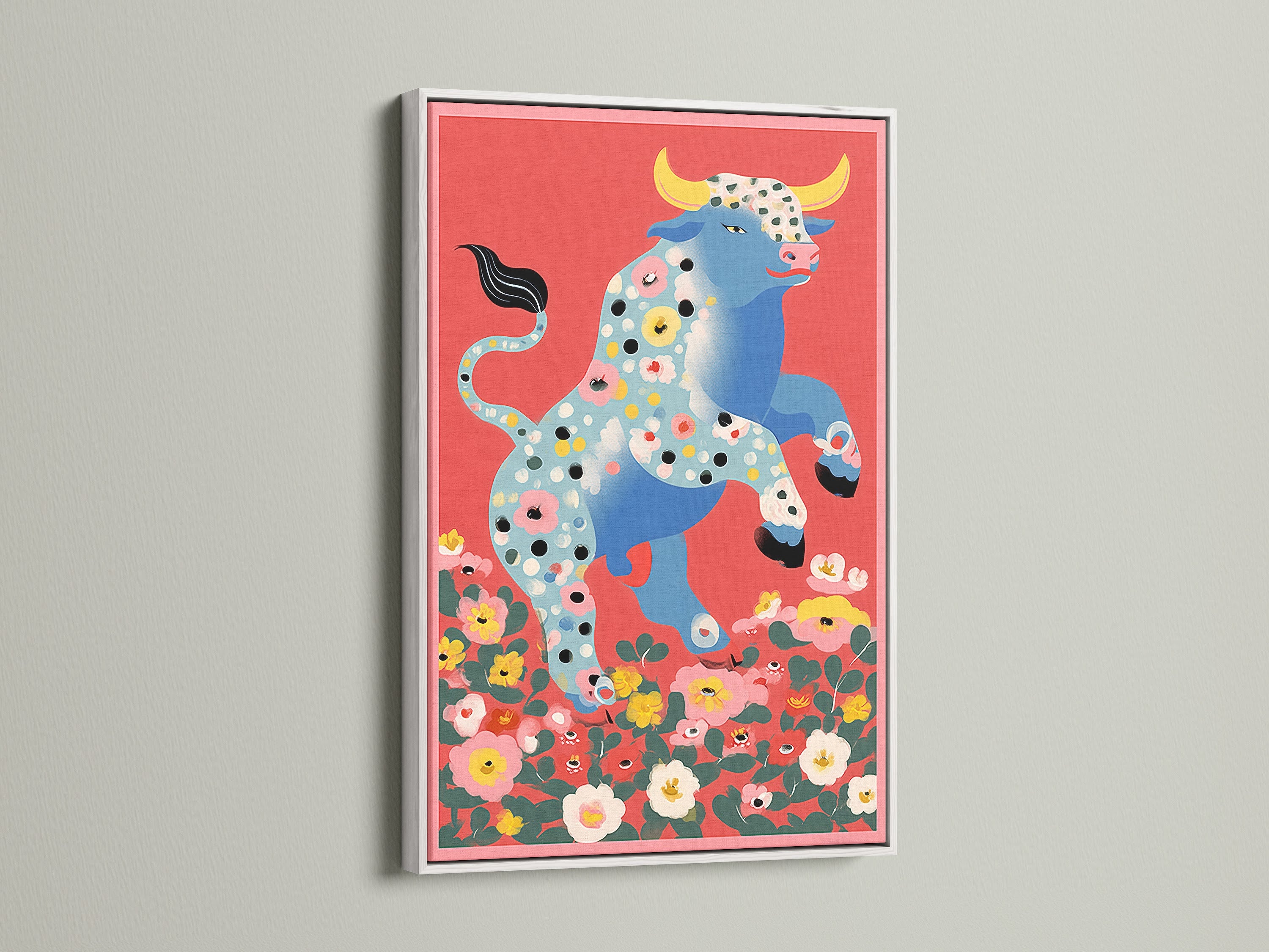 Floral Bull artwork in a white frame. This farmhouse style artwork is perfect for kitchens and nurseries. The colorful wall art features a bull with floral accents. The white frame enhances the artwork's vibrant colors. Ideal for renters and homeowners alike.
