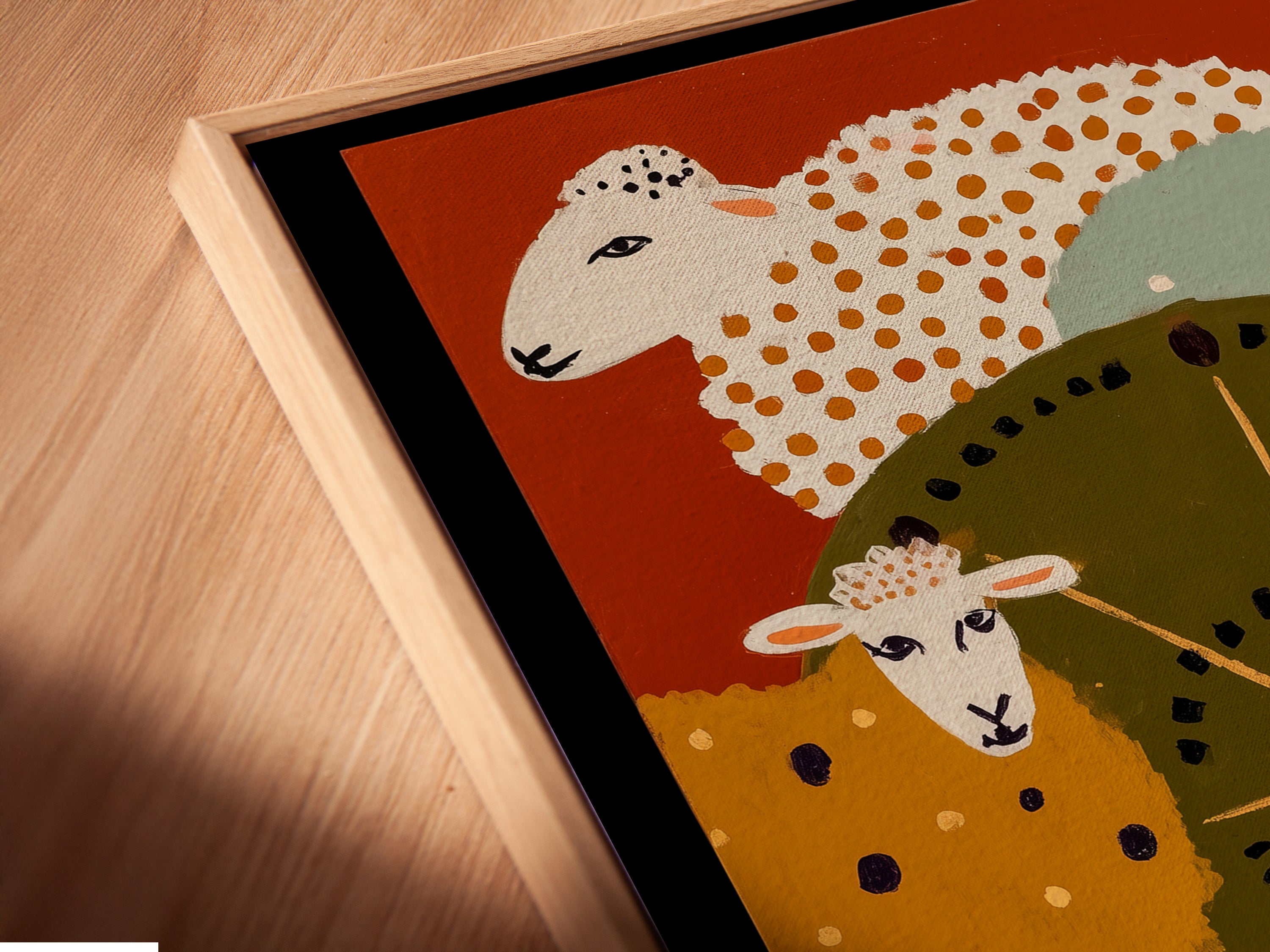 A close-up angled view of a canvas print in a floating frame. The sheep folk art appears to hover adding a modern touch. This framing style enhances the artwork making it a focal point. Perfect for adding a contemporary and whimsical element to any space. Ideal for nursery or kitchen.
