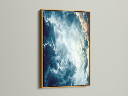 This is an abstract cloudscape canvas print. The artwork is showcased in a luxurious gold frame. This celestial decor adds a touch of elegance. Perfect for those seeking refined modern wall art. The gold frame enhances the dreamy art.