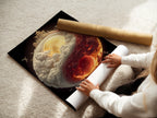 Woman carefully rolling a fine art poster paper. The poster paper is being prepared for framing. High-quality paper ensures the art lasts. Discover the importance of fine art paper. Preserve your artwork with the right materials. It protects and enhances the art.
