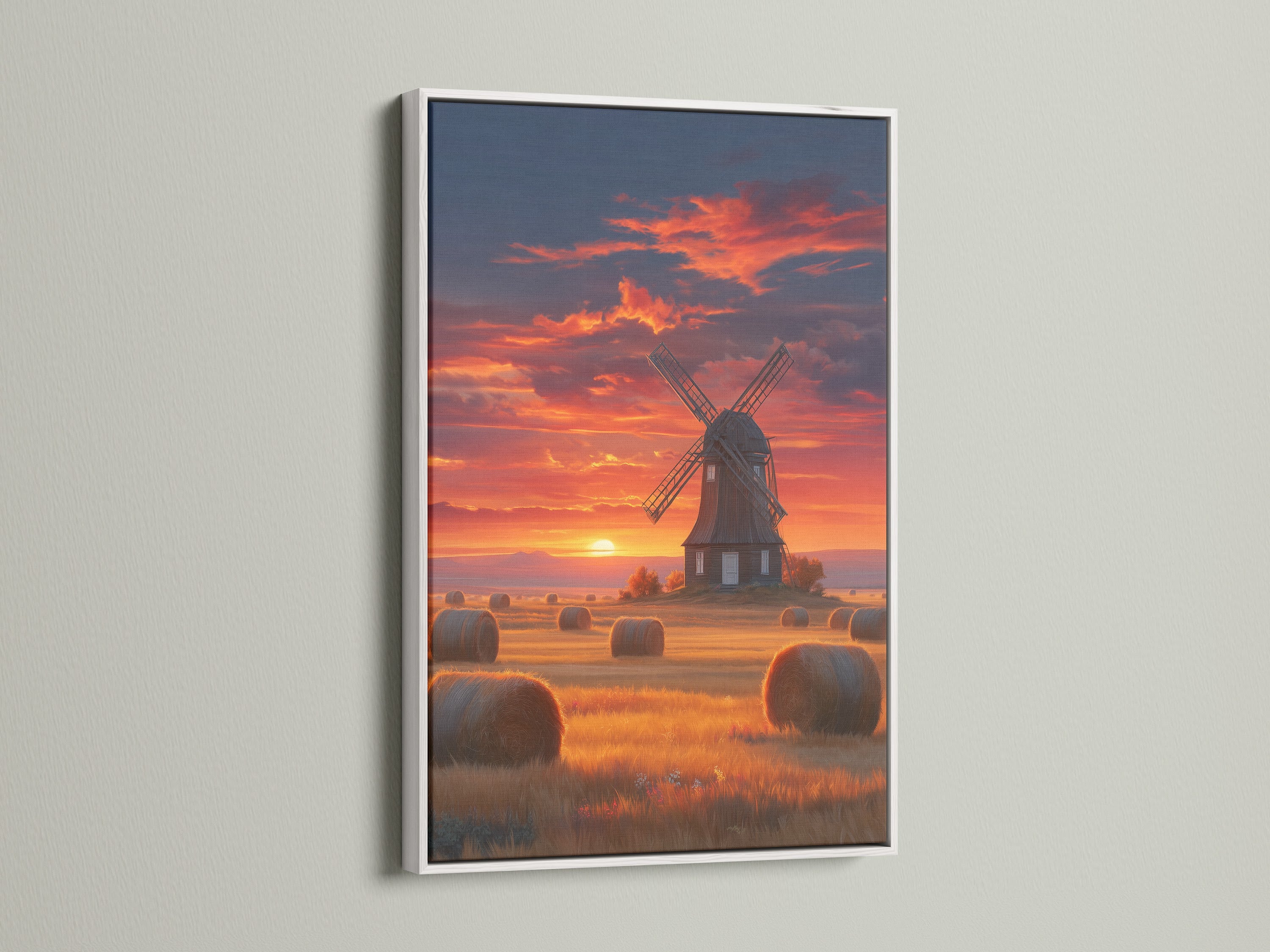 The windmill sunset artwork is showcased in a white frame. This fine art piece brings a serene Dutch countryside view to your home. It enhances any farmhouse style decor.