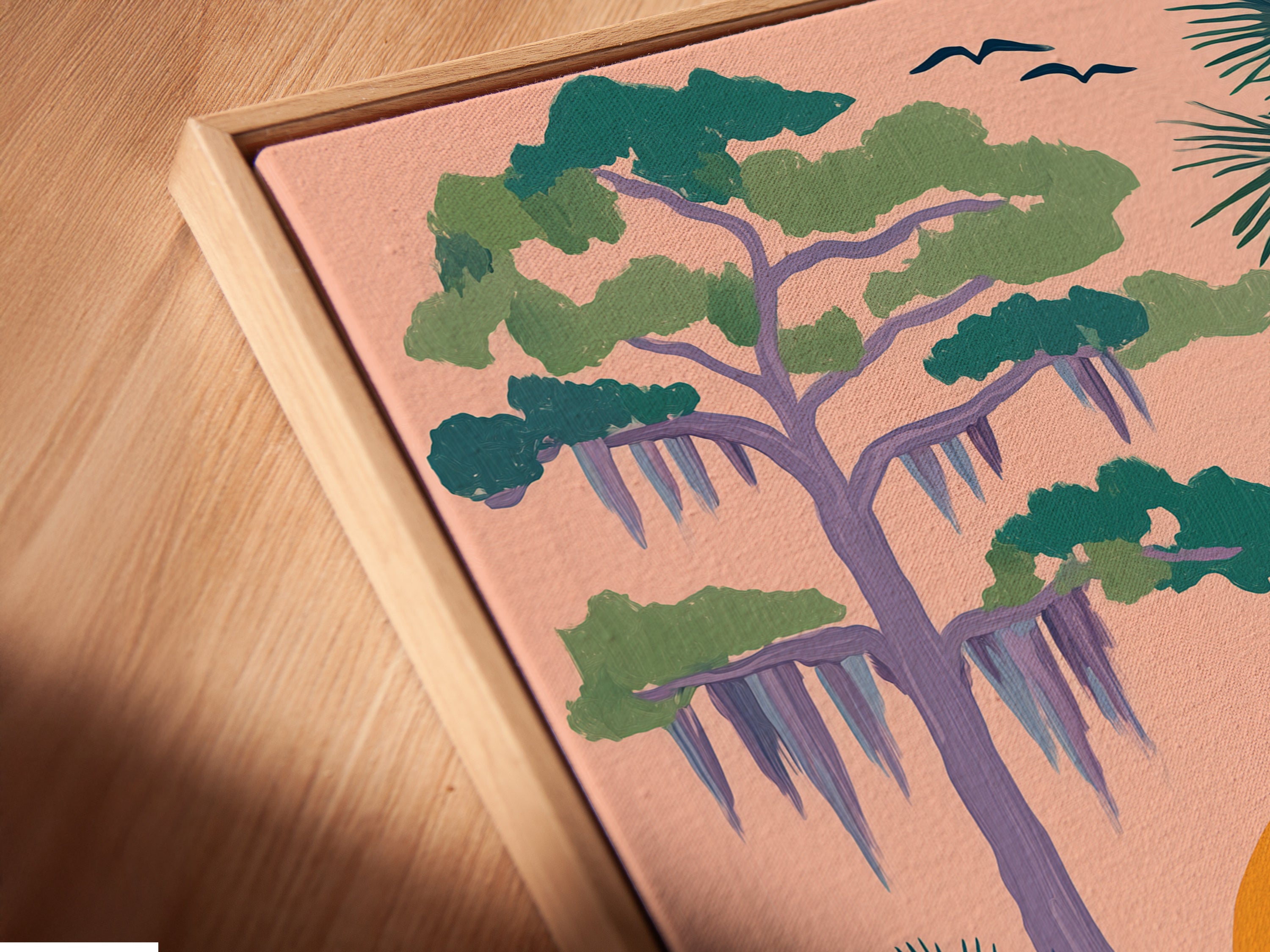 Angled close up of a canvas print in a floating frame. The heron artwork brings coastal charm to any space. The fine art print showcases serene herons in a Florida landscape. Perfect living room wall art for homeowners and renters.