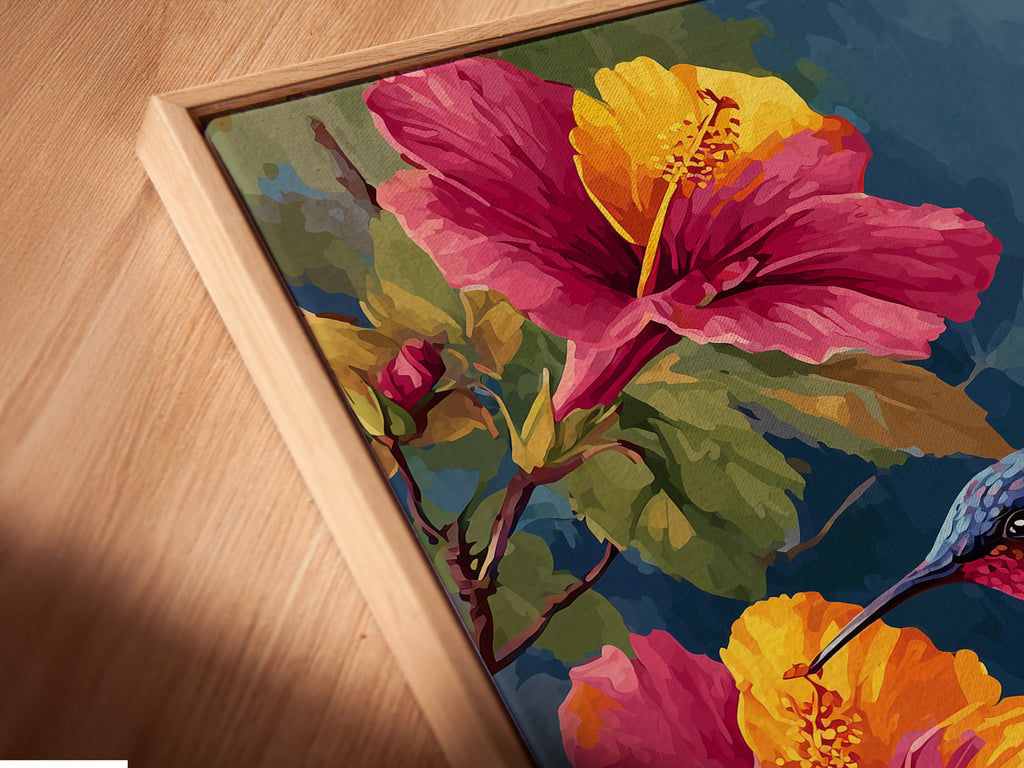 An angled close-up shows a canvas print in a floating frame. The artwork features a hummingbird with hibiscus flowers. The floating frame gives a modern gallery look. It makes the art stand out. Discover our unique framing options.