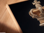 A close-up angled view reveals a canvas print in a floating frame. The artwork features a chess king piece. The floating frame adds depth and dimension to the artwork. It creates a modern and gallery-like presentation.
