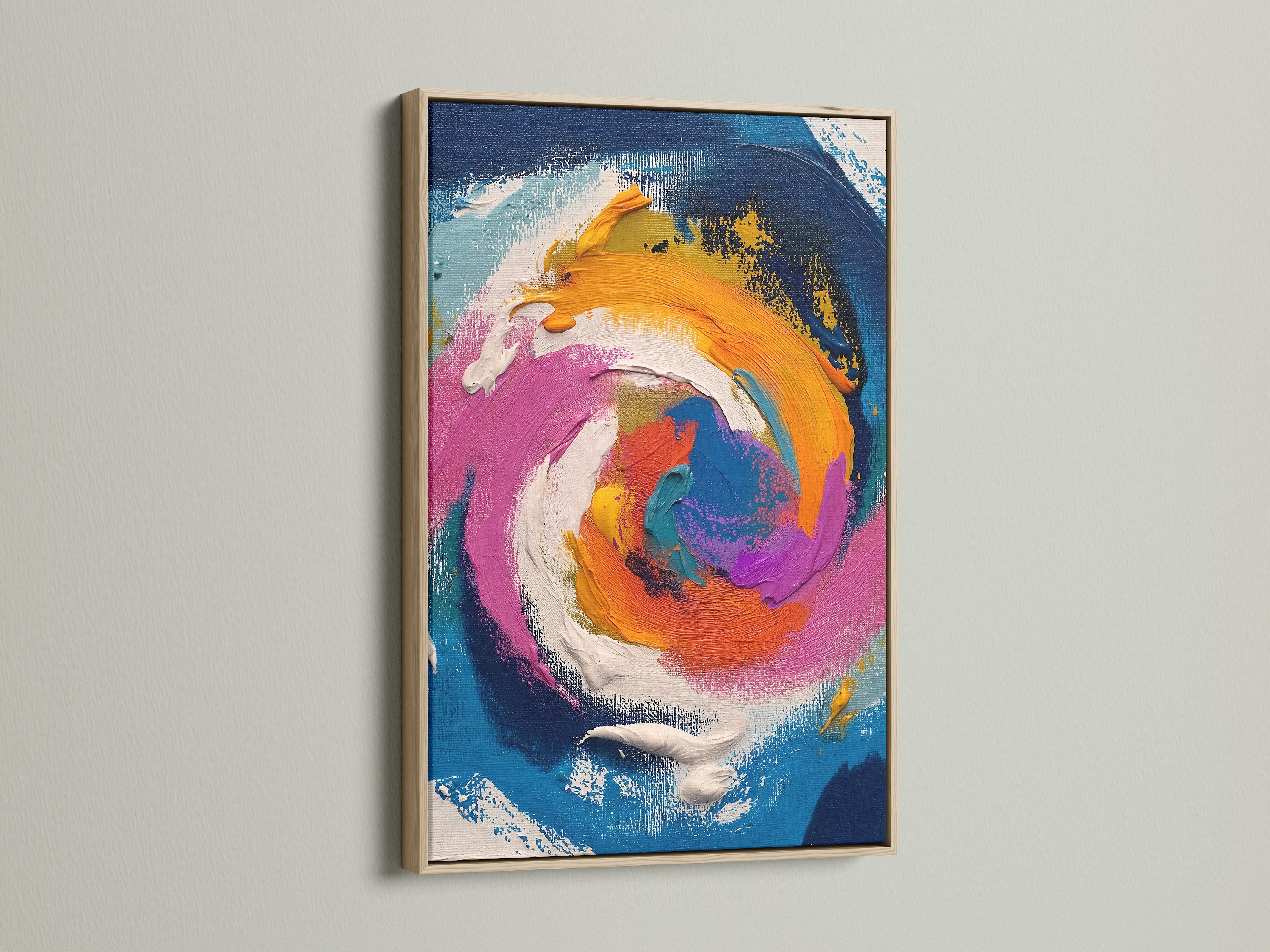 This image showcases an abstract swirl artwork in an oak frame. The artwork features a dynamic blend of colors. Blue orange pink and white swirl together in harmony. The oak frame adds a touch of natural warmth.