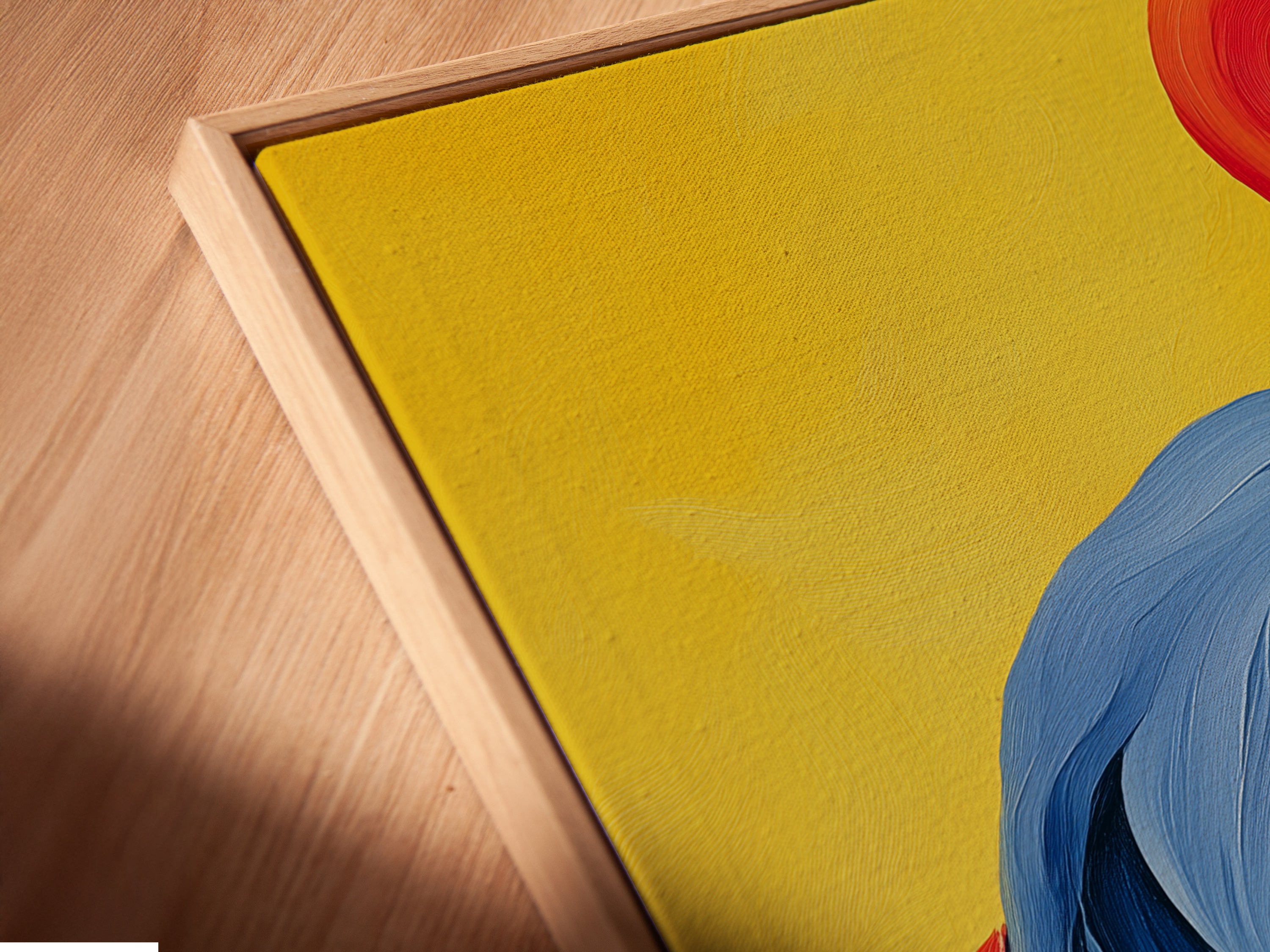 Close up angled view of a canvas print in a floating frame. The flamingo artwork appears to hover. This modern bird artwork is perfect for creating a focal point. The frame enhances the artwork's vibrant colors.