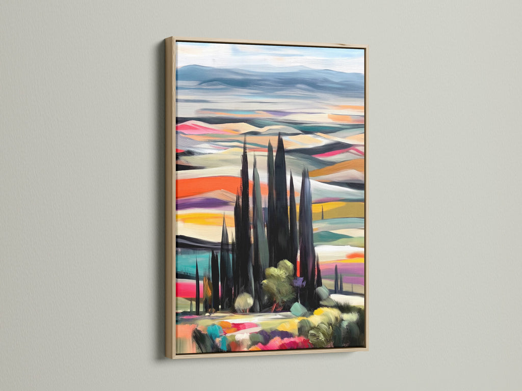 A captivating Tuscan Landscape artwork is showcased in an oak frame. This Italian art print brings the beauty of the countryside to your walls. The artwork features cypress trees and colorful scenery. Enhance your home decor with this stunning piece of landscape artwork.
