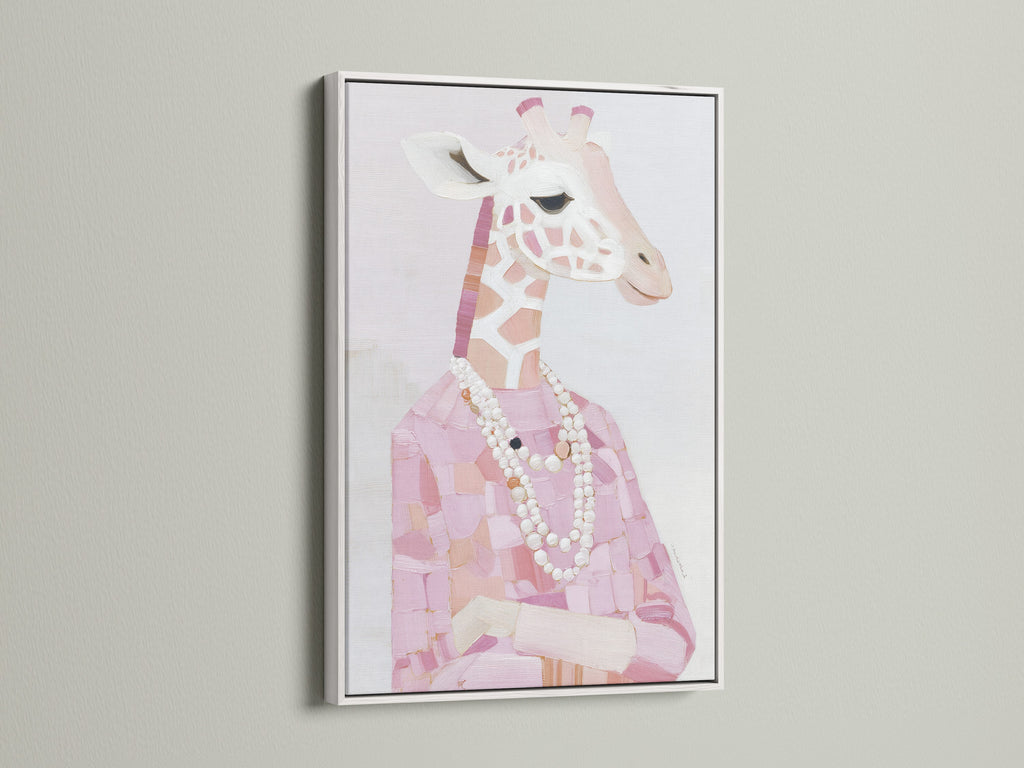 A white frame highlights a Giraffe Portrait Canvas Print. Pink animal print brings charm to any space. Fashion giraffe art with a pearl necklace is eye-catching. White frame enhances the blush pink art. This giraffe artwork is both stylish and unique.