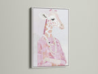 A white frame highlights a Giraffe Portrait Canvas Print. Pink animal print brings charm to any space. Fashion giraffe art with a pearl necklace is eye-catching. White frame enhances the blush pink art. This giraffe artwork is both stylish and unique.
