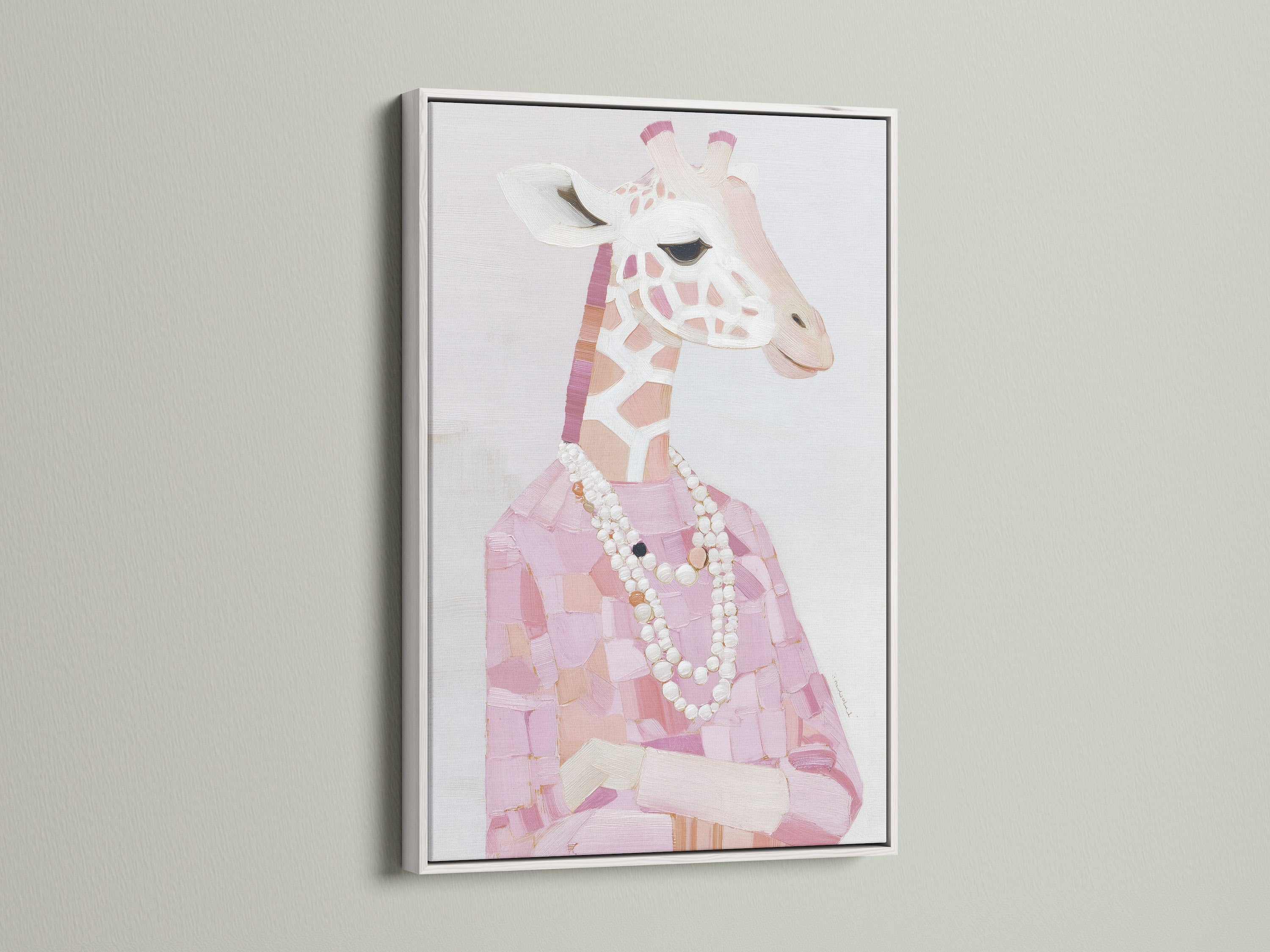 A white frame highlights a Giraffe Portrait Canvas Print. Pink animal print brings charm to any space. Fashion giraffe art with a pearl necklace is eye-catching. White frame enhances the blush pink art. This giraffe artwork is both stylish and unique.