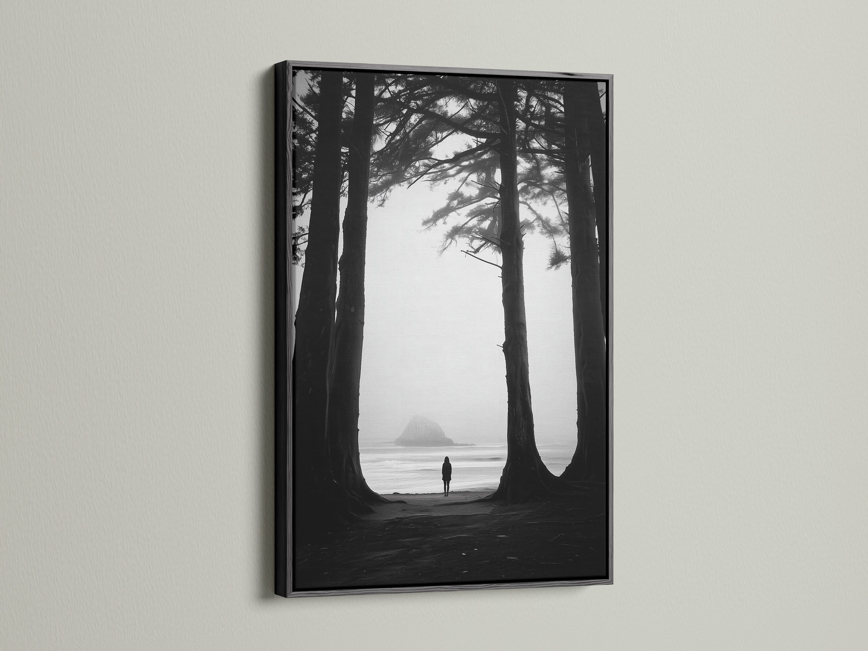 Black and white art print of a beach and forest. The artwork is presented in a sleek black frame. A black frame adds sophistication to any art piece. It creates a striking contrast with the wall. Consider a black frame for your next art purchase.