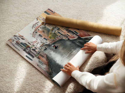 A woman is carefully rolling a fine art poster paper. This Venice Canal artwork is ready for framing. This Italian wall art will be a stunning addition to your European decor. Get ready to decorate.