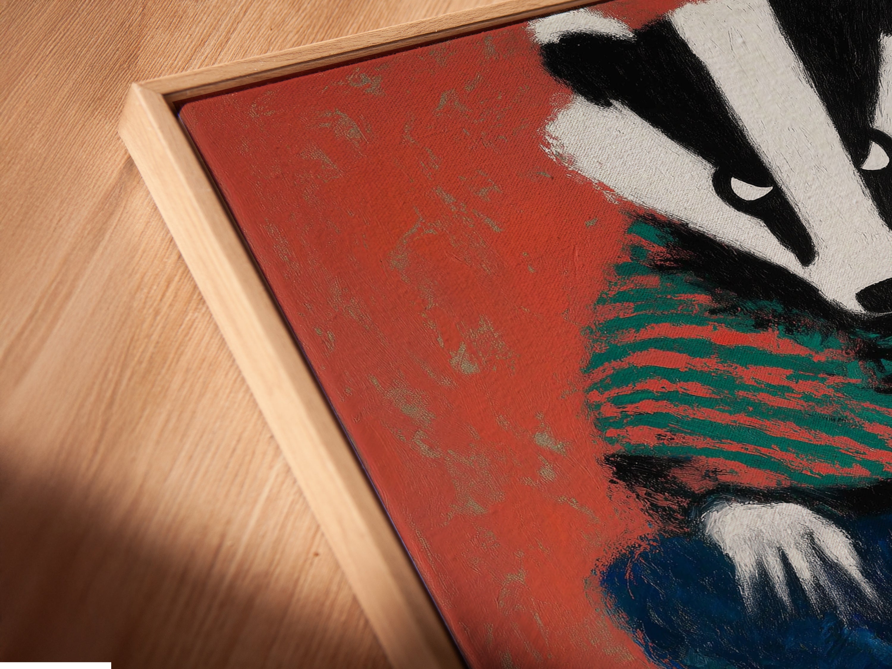 A close-up angled view showcases the canvas print in a floating frame. The frame enhances the folk art style of the badger artwork. This unique presentation adds depth to the whimsical animal wall art. It is a great choice for nursery wall decor and kids room art.