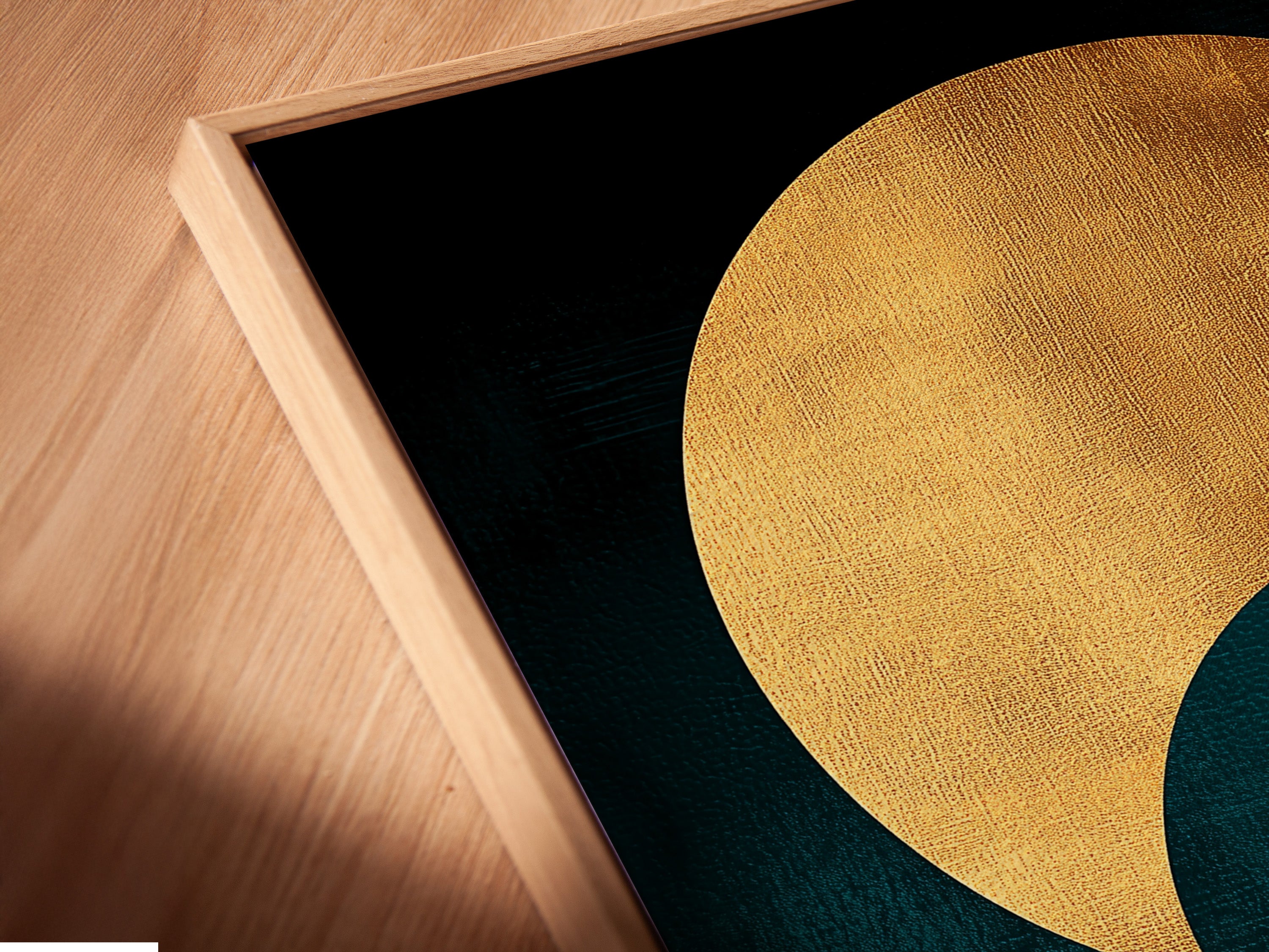 A close-up angled view of a canvas print in a floating frame. The teal and gold abstract sun wave artwork adds depth and sophistication. It's a contemporary print suitable for modern spaces. This piece is ideal for living rooms bedrooms and home offices.