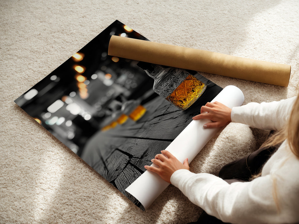 A woman is carefully rolling a fine art poster paper. This whiskey bar art is ready to be framed. The bourbon wall art is perfect for any space. Vintage bar decor adds a touch of elegance. Discover our selection of fine art poster prints for your walls.