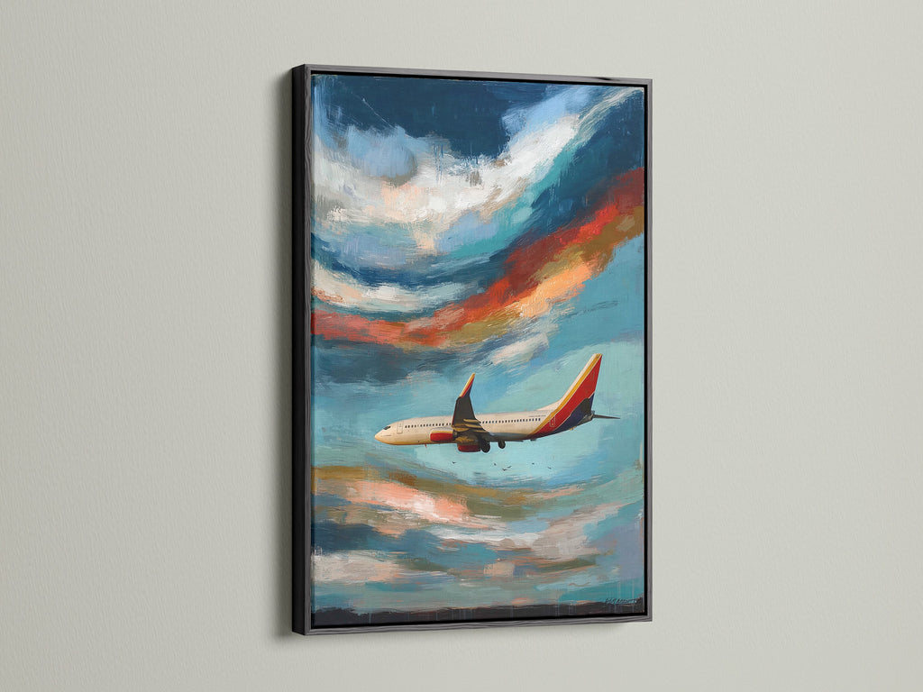 Airplane artwork is framed in black. The aviation print is a stunning sky canvas art piece. It is a modern cloudscape painting perfect for office decor. Makes a thoughtful gift for pilots. The blue and orange hues evoke a sense of flight.