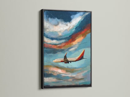 Airplane artwork is framed in black. The aviation print is a stunning sky canvas art piece. It is a modern cloudscape painting perfect for office decor. Makes a thoughtful gift for pilots. The blue and orange hues evoke a sense of flight.