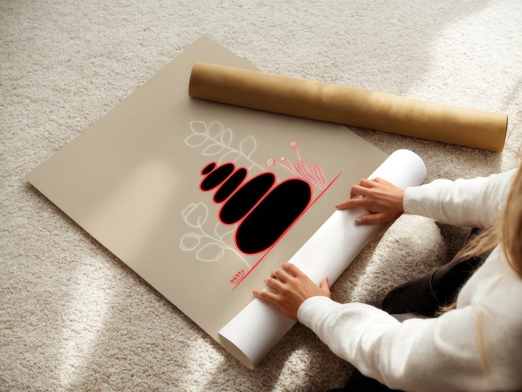 A woman carefully rolling a fine art poster paper of Zen Stones artwork.  This beige minimalist piece is ideal for spa decor.  The calming print is perfect for bathroom artwork. Choose fine art for a peaceful balanced feel.