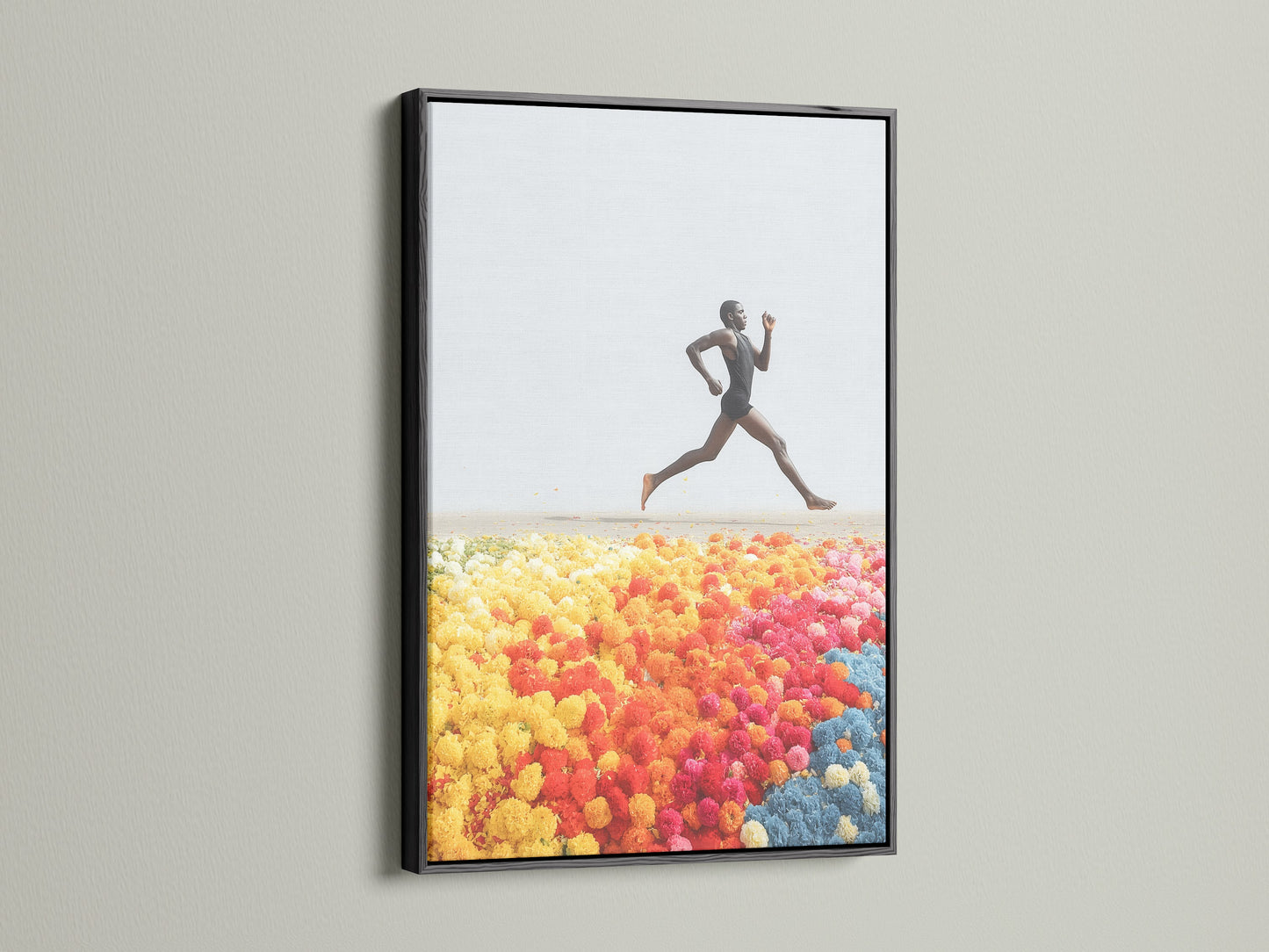 Runner Canvas Print is elegantly framed in black. The artwork depicts an energetic pose. This piece makes a bold statement as athlete wall art. Discover our range of modern art and colorful prints today.