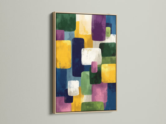 Abstract Geometric Canvas artwork in an oak frame. The artwork features colorful blocks in blue yellow and purple. This contemporary print adds a refined touch. Ideal for living rooms bedrooms and offices.