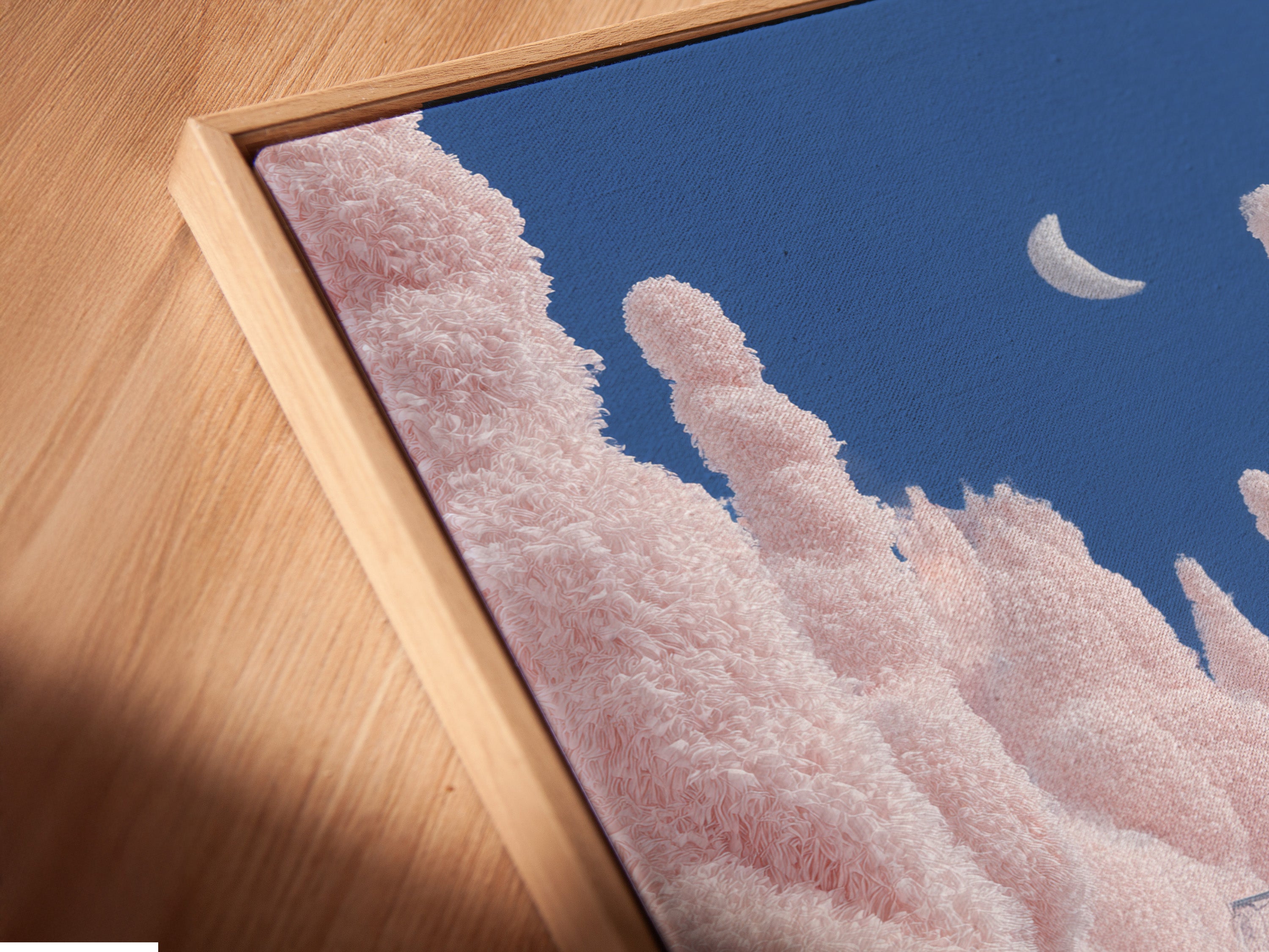 A close-up angled view reveals a canvas print. It is set in a stylish floating frame. The floating frame gives the artwork a contemporary edge. It makes the pink snow forest print stand out. This adds depth and dimension to the piece.
