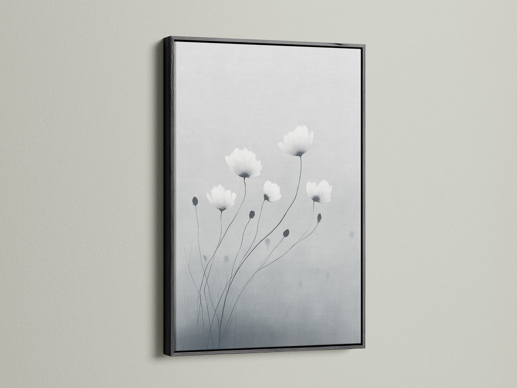 Enhance your decor with minimalist flower artwork in a black frame. The gray and white botanical wall art stands out beautifully. This modern canvas art is ideal for adding sophistication to your space. Black frames add a bold touch to neutral art pieces.