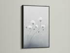 Enhance your decor with minimalist flower artwork in a black frame. The gray and white botanical wall art stands out beautifully. This modern canvas art is ideal for adding sophistication to your space. Black frames add a bold touch to neutral art pieces.