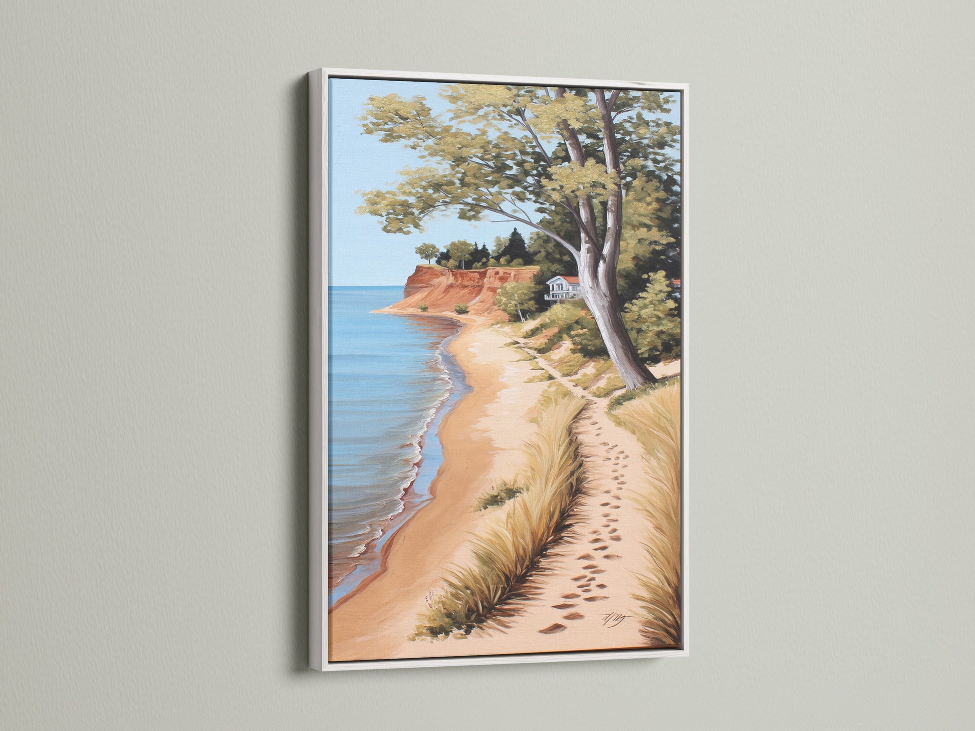 Coastal Beach Artwork in a White Frame. This serene ocean view print captures a sandy shoreline. Ideal for coastal cottage decor. It brings a touch of the beach to your space. Discover framed artwork to enhance your home's ambiance with this calming piece.