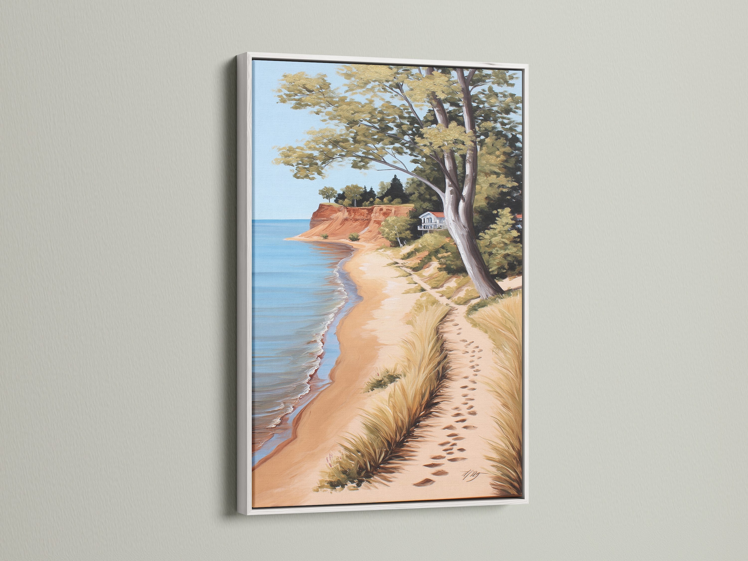 Coastal Beach Artwork in a White Frame. This serene ocean view print captures a sandy shoreline. Ideal for coastal cottage decor. It brings a touch of the beach to your space. Discover framed artwork to enhance your home's ambiance with this calming piece.