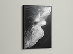 This artwork features a black and white ocean wave. It is showcased in a sleek black frame. A striking beach canvas print. It suits modern and nautical styles. Its monochrome art adds sophistication to any room. Perfect for living room wall art. Enhance your space with this coastal decor masterpiece.