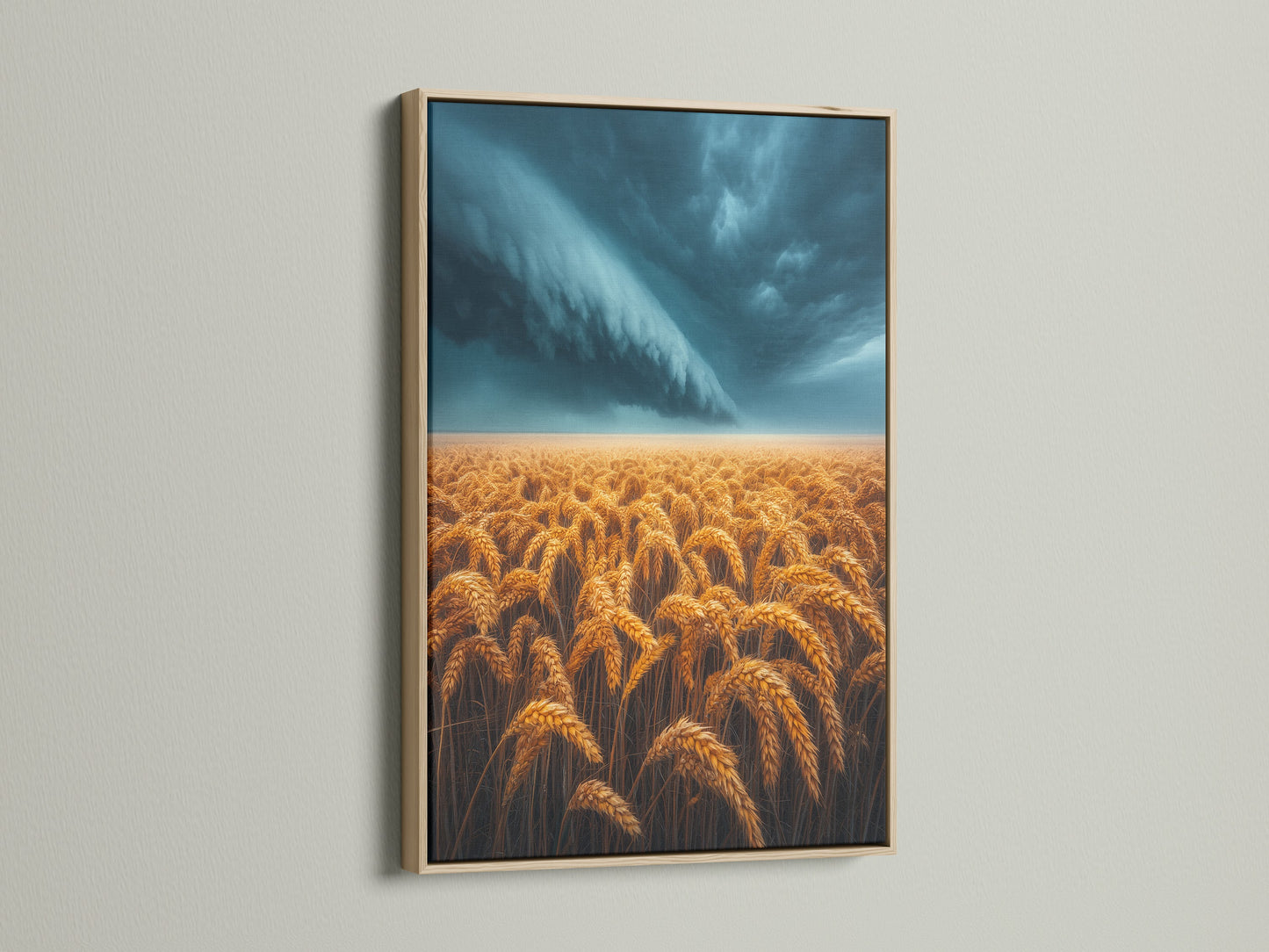 Wheat Field artwork in an oak frame. This piece features a golden wheat field under a dramatic stormy sky. It is ideal for adding rustic charm to any space. A wonderful choice for Farmhouse wall art.