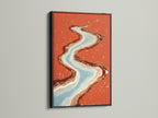 The black frame highlights the abstract river art. This modern canvas art features flowing water in coral and teal. It offers a bold contrast for a contemporary look. This artwork will enhance your living room bedroom or boutique. Discover the beauty of this abstract landscape.