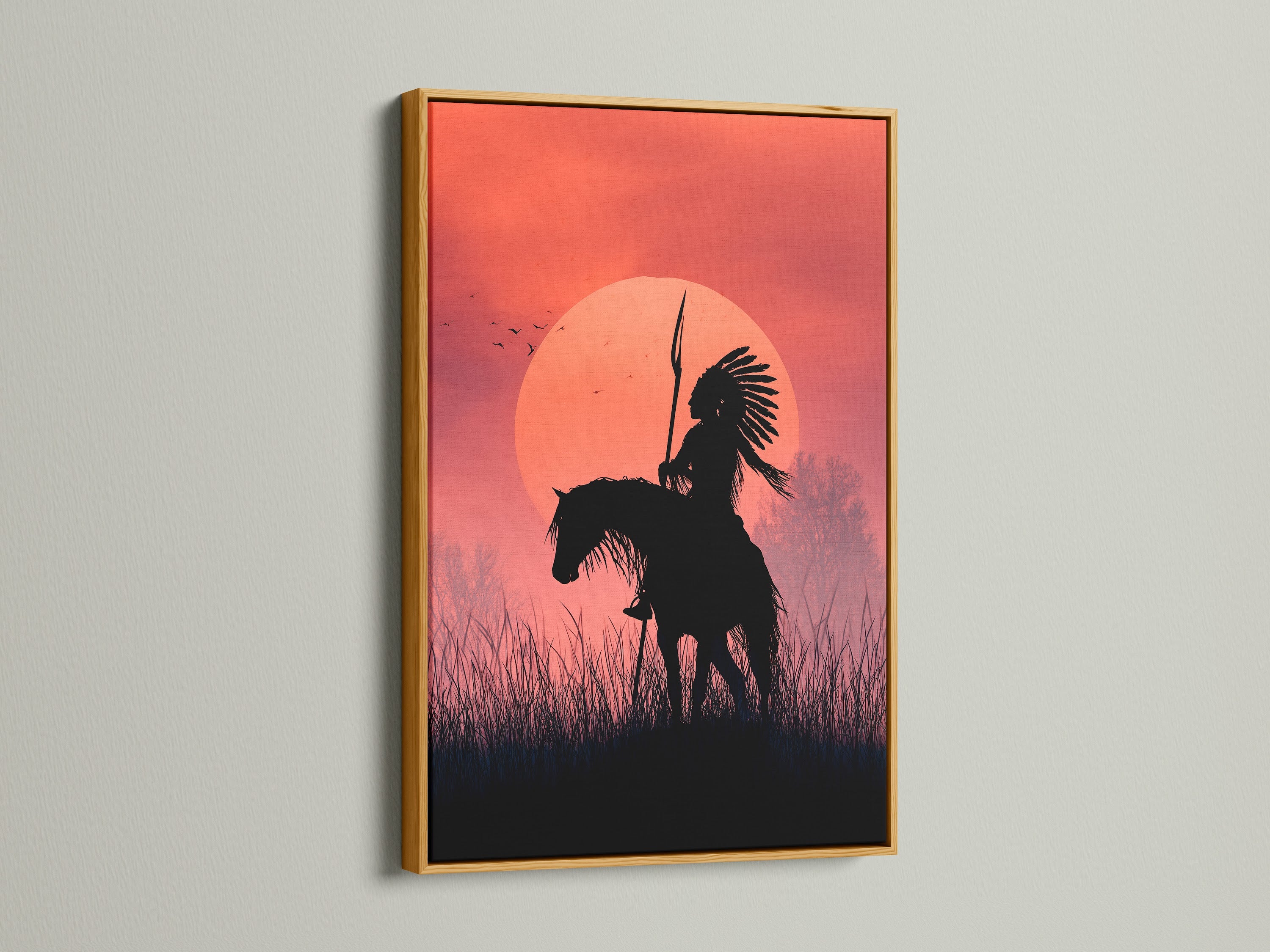 An artwork of an indigenous person on horseback at sunset is displayed in a gold frame. The gold frame adds a touch of luxury. This framed art will elevate your home decor. Perfect for art collectors and enthusiasts.