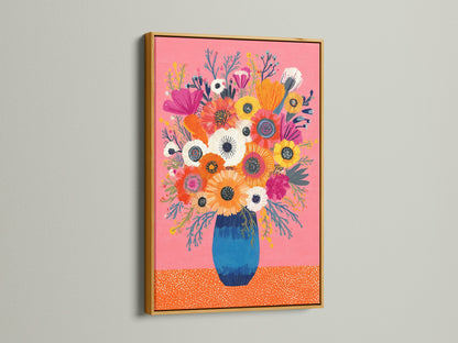 Gold frame enhances a vibrant floral artwork. The artwork features a pink background and a blue vase. The gold frame adds a touch of luxury. This artwork brings a touch of opulence to your space. Elevate your artwork with a touch of gold.