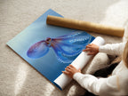 A woman carefully handles a fine art poster paper. She is preparing to create a stunning octopus artwork print. The paper is perfect for capturing the details of the teal blue sea canvas. High-quality materials ensure a beautiful marine animal artwork piece. Soon it will be ocean print.