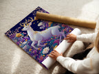 A woman is carefully rolling a fine art poster paper. The image shows attention to detail in preserving the delicate artwork. Fine art paper is a great option for affordable wall art.