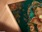 Close-up of a Ganesha canvas print in a floating frame. The Hindu artwork features a spiritual elephant god. The teal and gold colors create a serene vibe. Ideal for meditation room decor and yoga studios. This floating frame enhances the artwork.