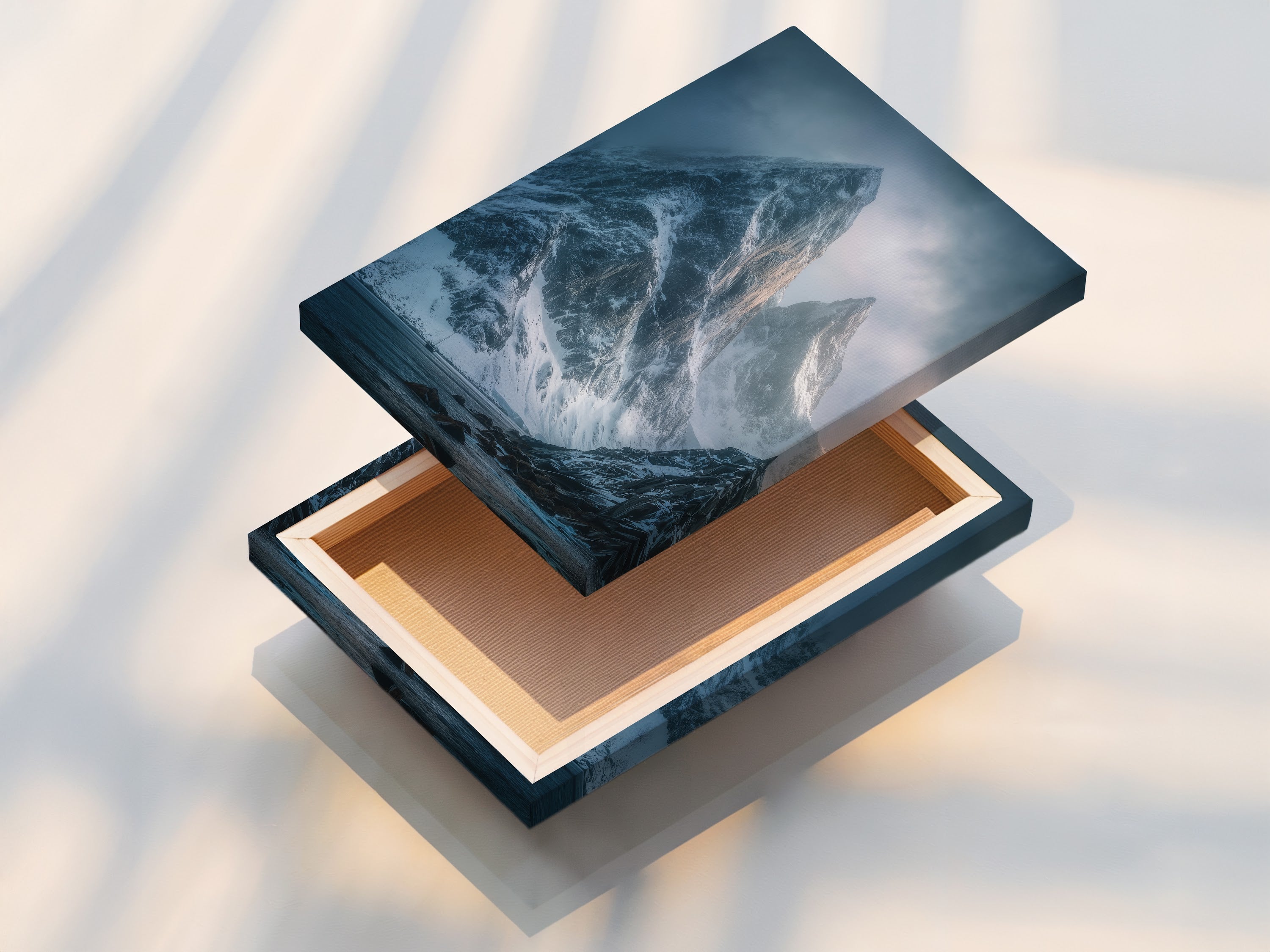 A stretched canvas print ready to hang. This mountain art features a snowy landscape. The moody blue photography creates a captivating display. Perfect for modern wall decor and nature prints.