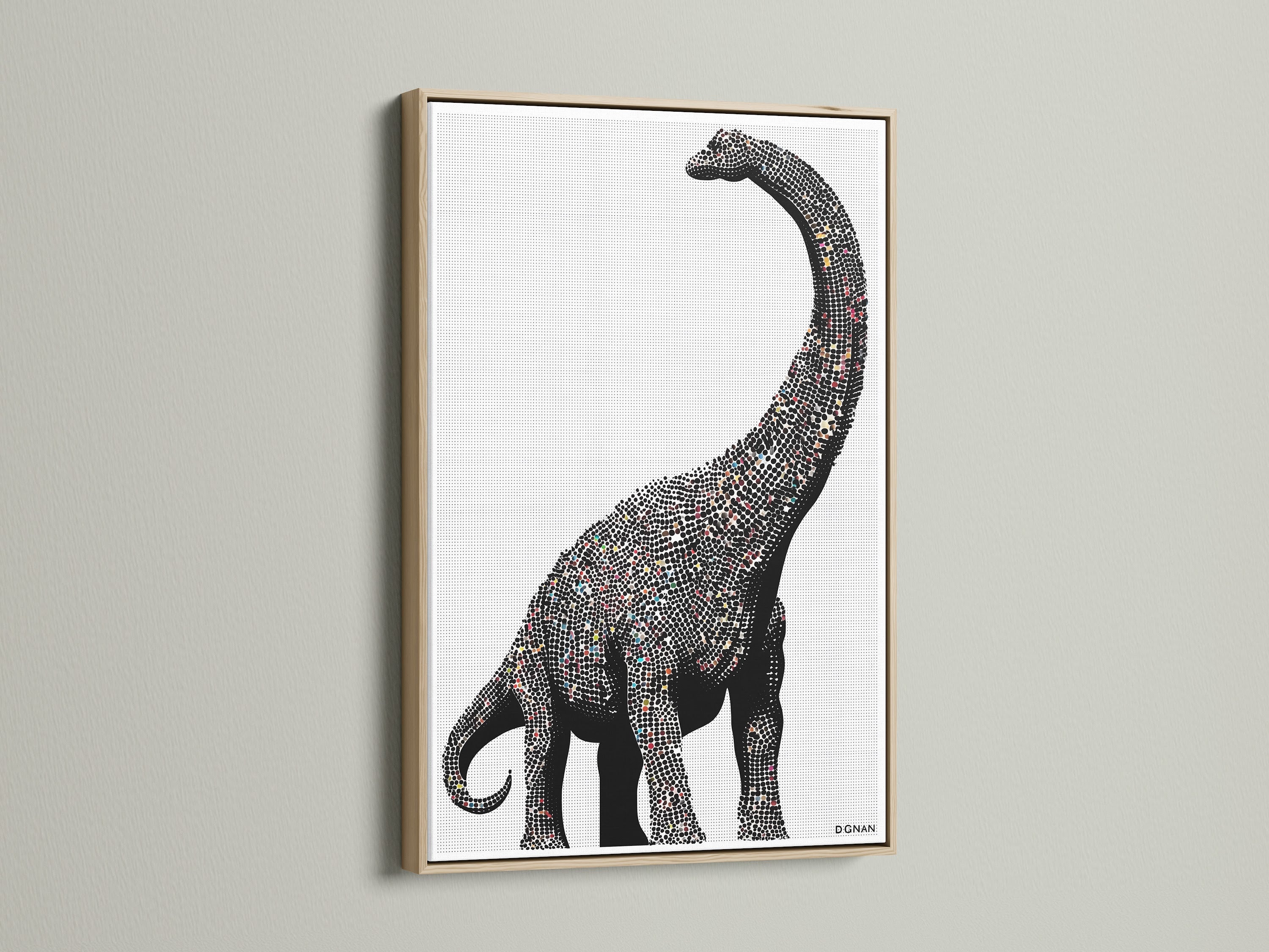 Dinosaur wall art featuring a minimalist brontosaurus canvas print. It is perfect modern nursery decor for a kids room. The artwork has an oak frame. Black and white animal art fits minimalist and Scandinavian styles.